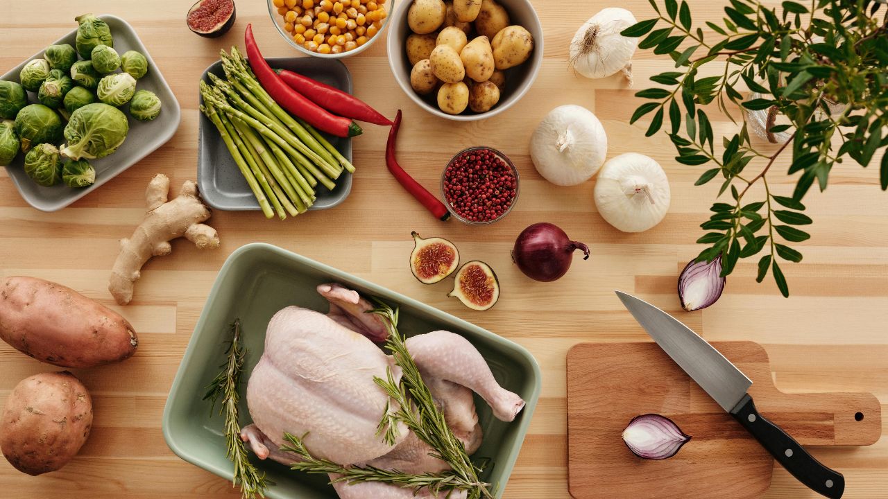 Ingredients for Purple Onion Chicken Recipe on a rustic board.