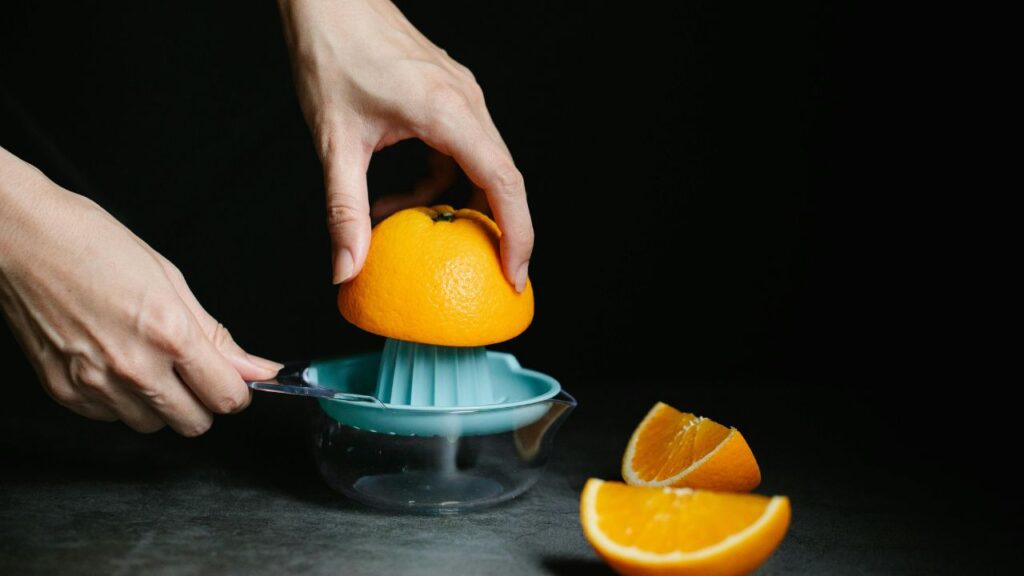 The process of making fresh juice recipes at home using a centrifugal juicer.
