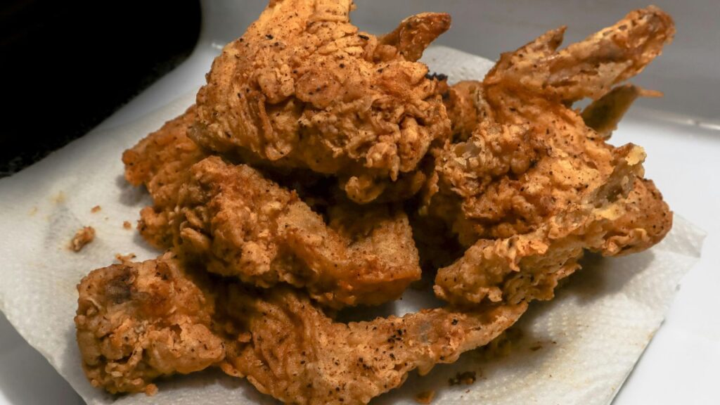 Dredging process for extra crunchy fried chicken skin.