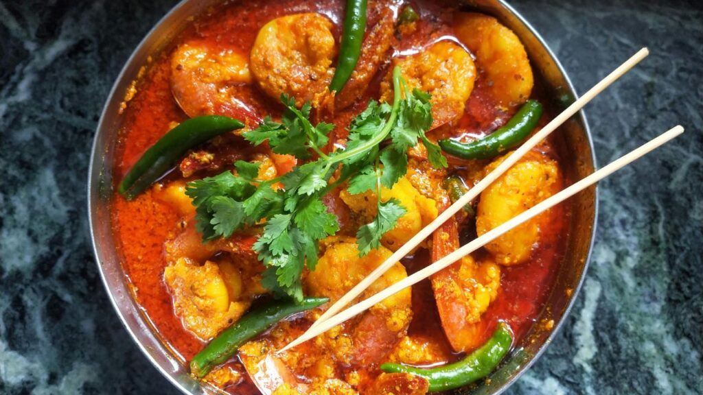 Sizzling aromatics in a hot wok.