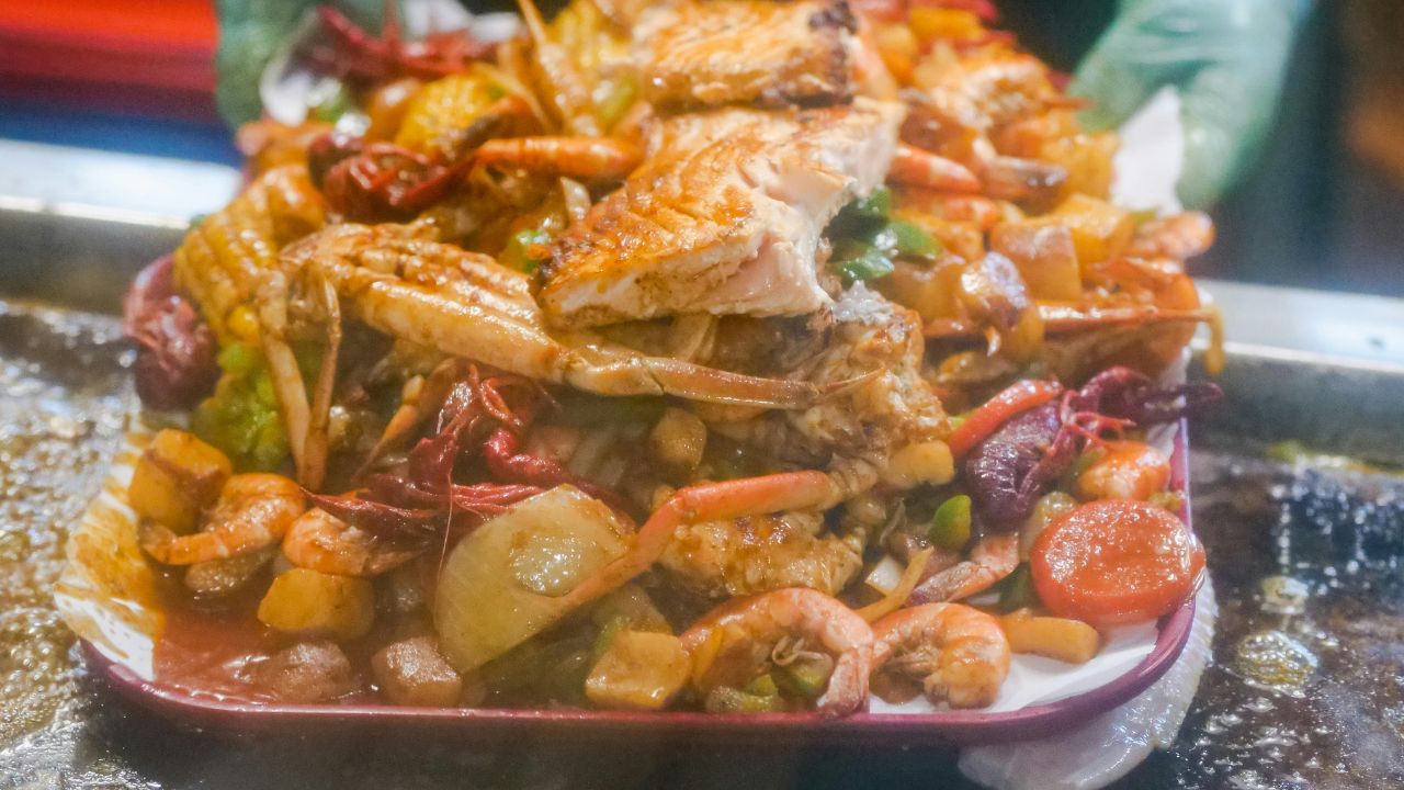 Steaming ingredients for a Spicy Seafood Boil Recipe.