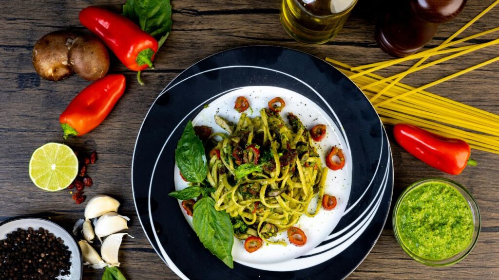 A finished plate of Creamy Eggplant Pasta Recipe garnished with herbs and spices.