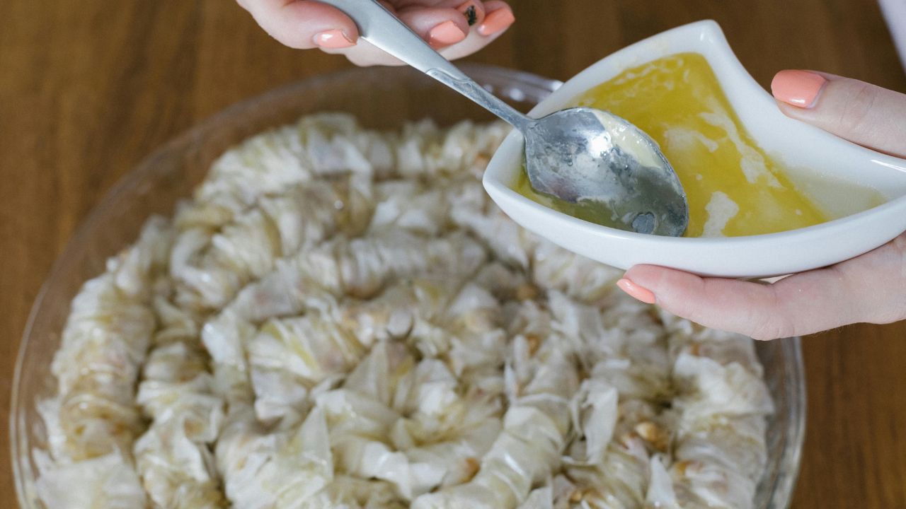 A fluffy scoop of creamy country mashed potatoes with melted butter and fresh chives.