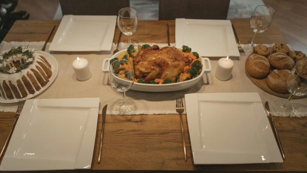 An empty glass baking dish on a counter after a family dinner.