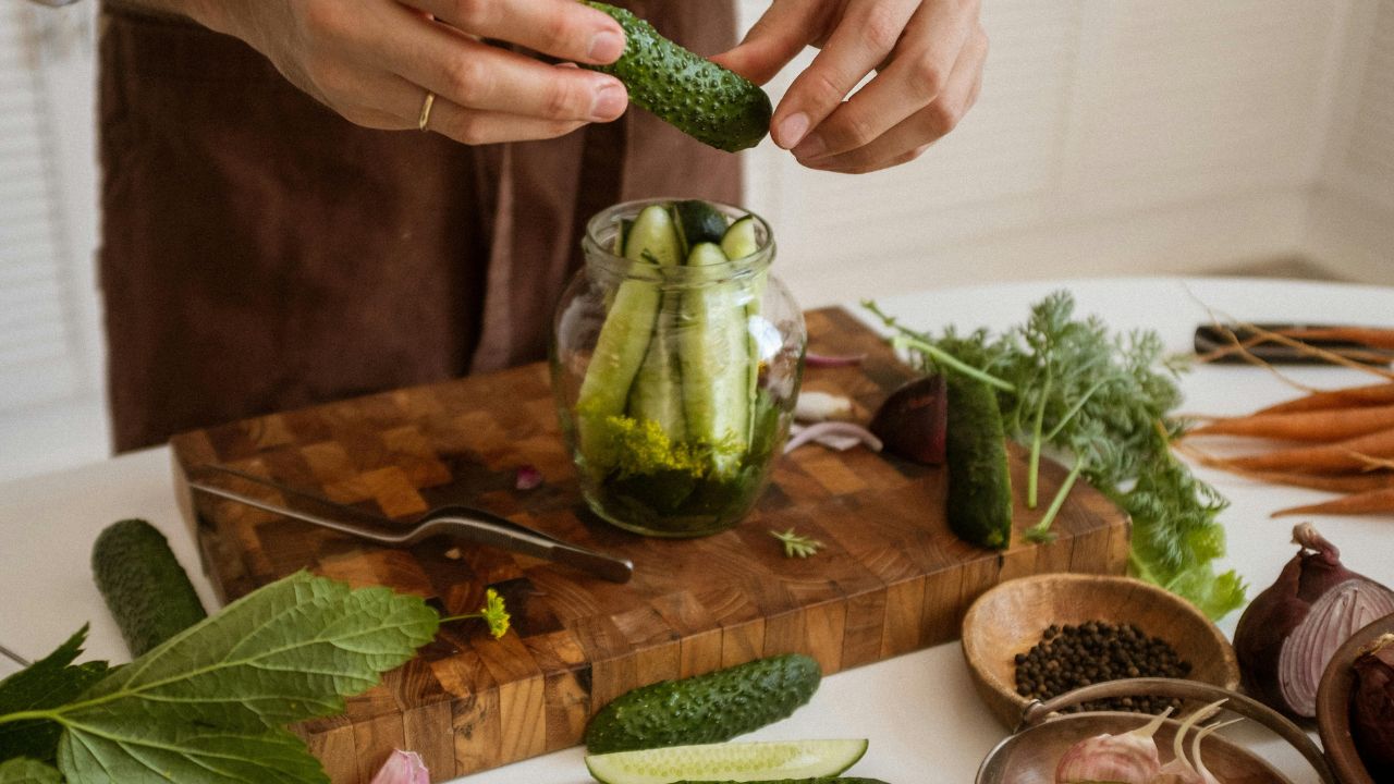 Jars of quick homemade pickles packed with dill and garlic.