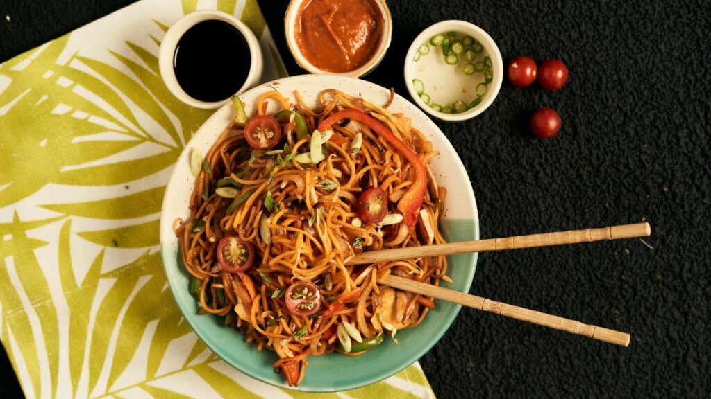 _Savory stir-fry noodles being lifted with chopsticks, an easy dinner idea.