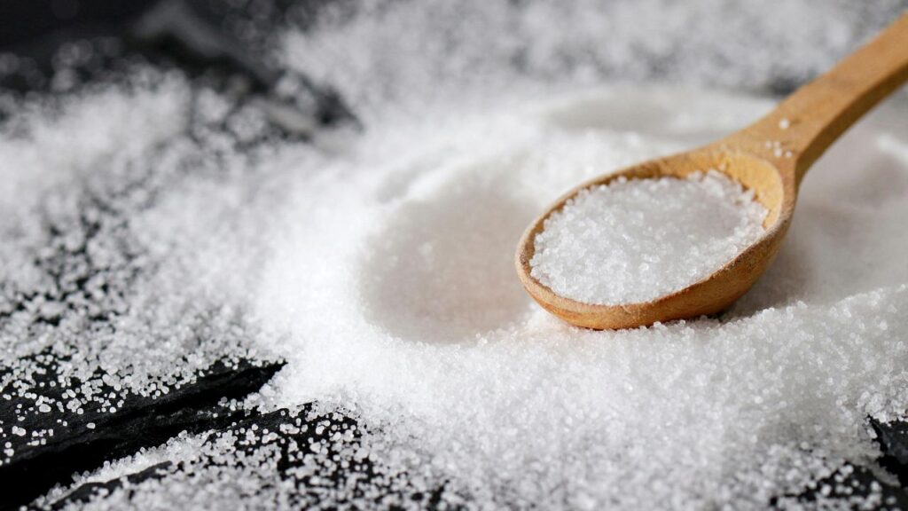 Close up of white erythritol crystals showing the granular texture.