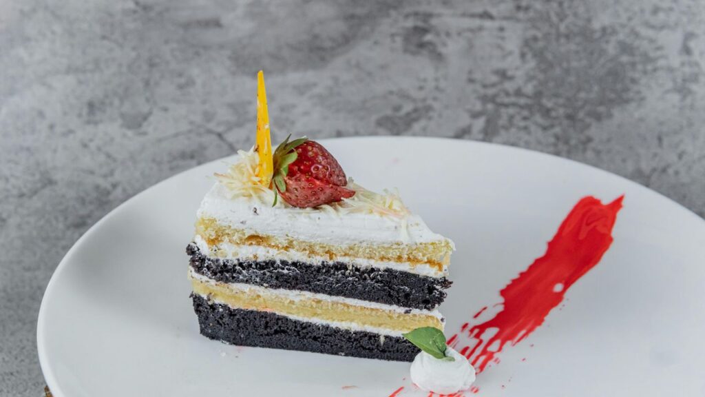 _A moist, thawed slice of cake ready to be served, looking fresh and delicious.