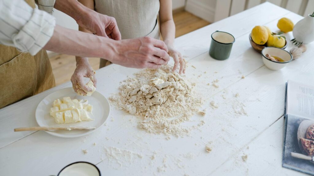 Mixing cold butter into flour for scone dough