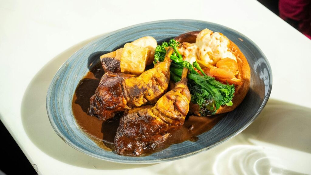 cooked beef tips crock pot served with gravy and mashed potatoes